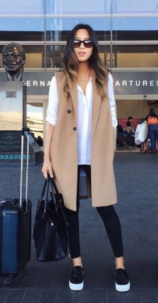 white shirt with buttons and camel longline vest