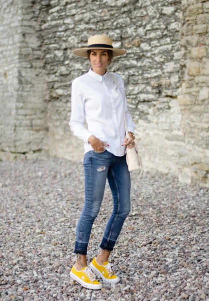 white shirt with buttons, jeans with cuffs and yellow sneakers