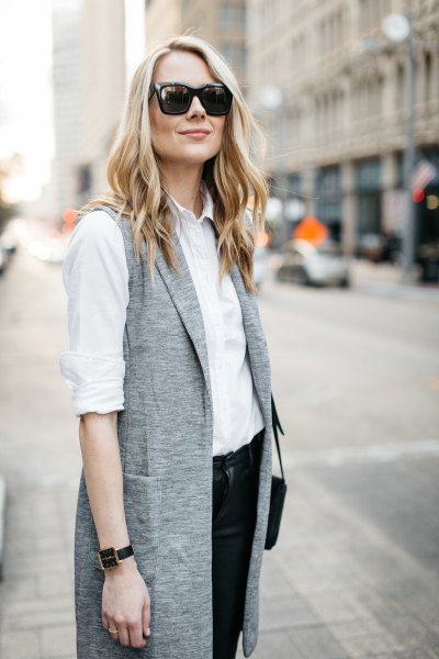 white shirt with buttons and gray mottled longline vest