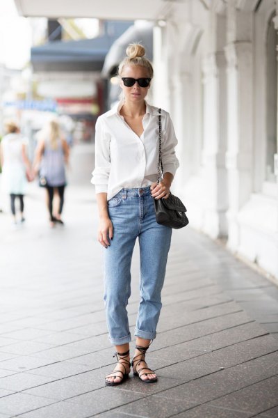 white shirt with buttons and light blue jeans with cuffs and relaxed fit