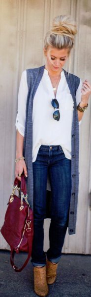 white shirt with buttons, sleeveless longline cardigan and brown boots
