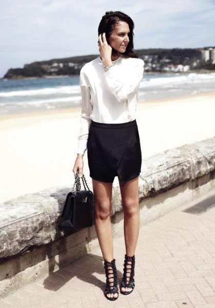 white shirt with buttons, skort and black lace-up sandals