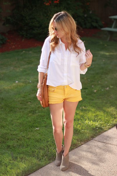 white shirt with buttons and yellow denim shorts