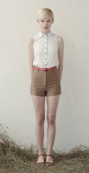 white sleeveless blouse with buttons and green mini-shorts with high waist