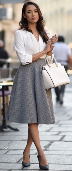 white blouse with V-neck and gray, checked midi skirt