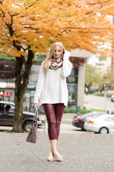 white, coarsely knitted sweater with scarf and burgundy leggings