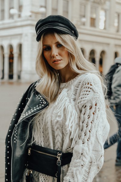White, coarsely knitted sweater with a moto rivet jacket and leather painter's hat