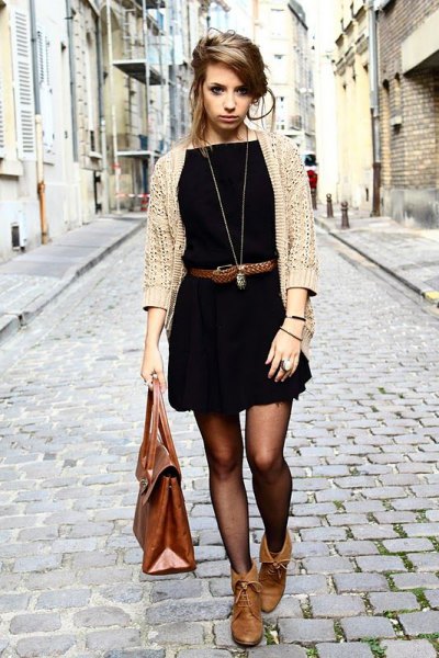 white cable cardigan and black mini dress with belt