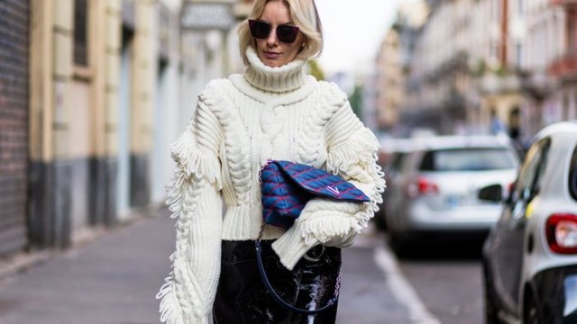 white turtleneck sweater with cable pattern and black leather pants