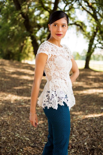 white lace peplum with cap sleeves and blue polka dot cotton trousers