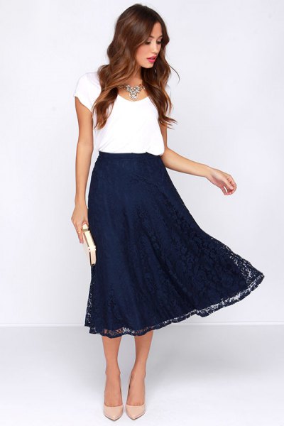 white t-shirt with cap sleeves and a flared midi skirt in navy blue