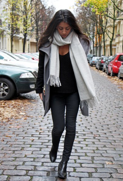 white cashmere scarf black sweater gray vest