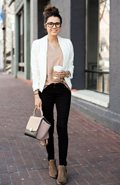 white, casual blazer with a pink top and black skinny jeans