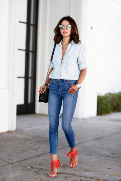 white chambray shirt with blue skinny jeans with a low waist