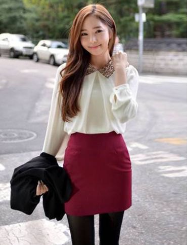 white chiffon blouse with a burgundy, figure-hugging mini skirt