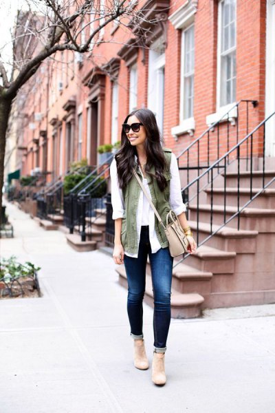 white chiffon blouse with olive green vest and light pink shoulder leather bag