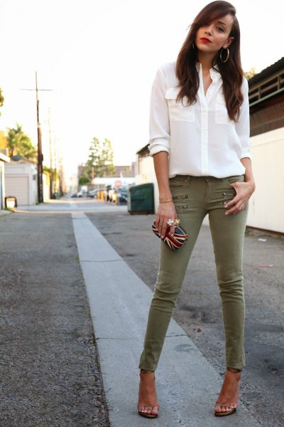 white chiffon blouse with buttons and olive-green drainpipe trousers