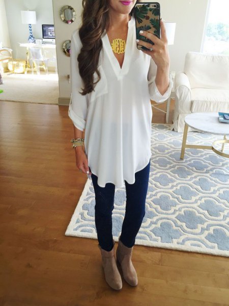 white chiffon tunic top with dark blue skinny jeans and leather boots