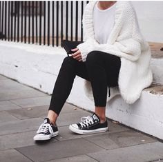 white, chunky knit sweater with black ankle jeans