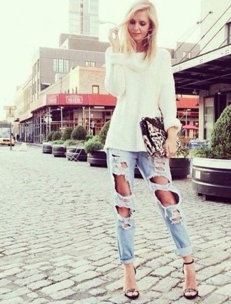 white, coarsely knitted sweater with light blue boyfriend jeans
