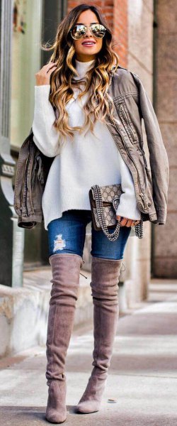 white, chunky sweater with light gray, oversized leather jacket and over-the-knee suede boots