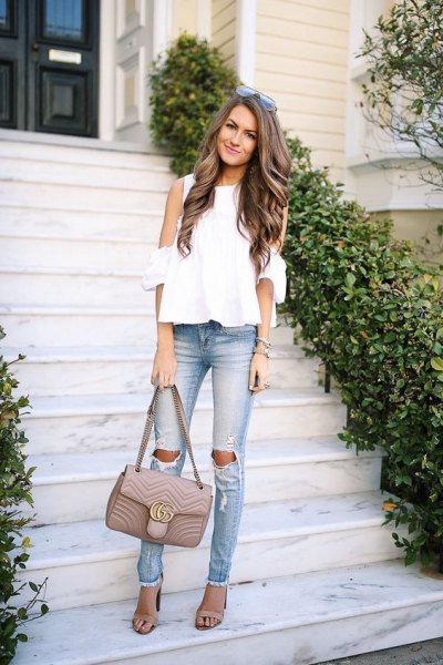 white chiffon blouse with cold shoulder and ripped slim fit jeans