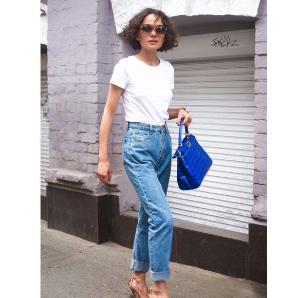 white crew-neck t-shirt and blue vintage high-waisted straight-leg jeans