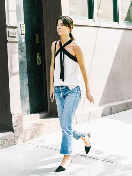 white criss-cross front blouse with ankle jeans and black kitten heels