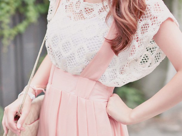 white crochet top with cap sleeves and light pink suspender dress