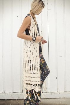 white crochet maxi knitted vest in maxi length with leggings with floral pattern