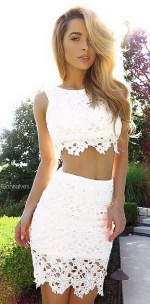 white crocheted two-piece, figure-hugging dress