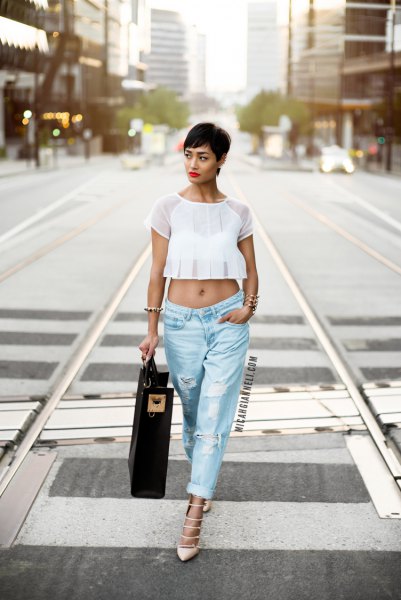 white, cropped chiffon top with light blue, torn baggy boyfriend jeans