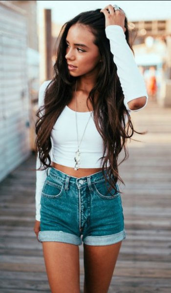 white, short-cut long-sleeved T-shirt with gray denim shorts with cuffs