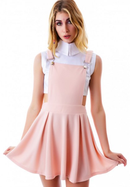 white, cropped sleeveless blouse with blushing pink mini skater stocking dress