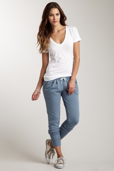 white t-shirt with deep V-neck and gray sweatpants