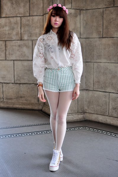 white embroidered shirt with striped white shorts