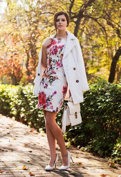 white, figure-hugging wool coat with a floral pattern
