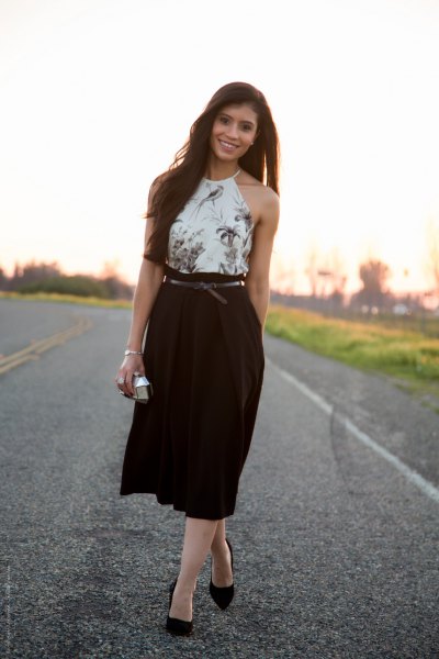 white floral halter top, high-waisted black midi pleated skirt