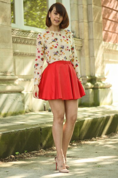 white floral long-sleeved blouse, red pleated minirater skirt