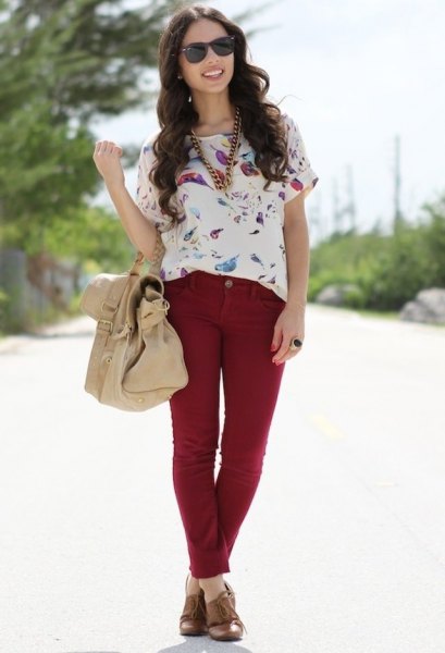 white short-sleeved blouse with floral pattern and red slim fit jeans