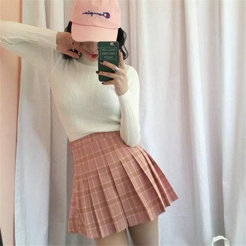 white bodycon sweater with pink checked skirt and white baseball cap