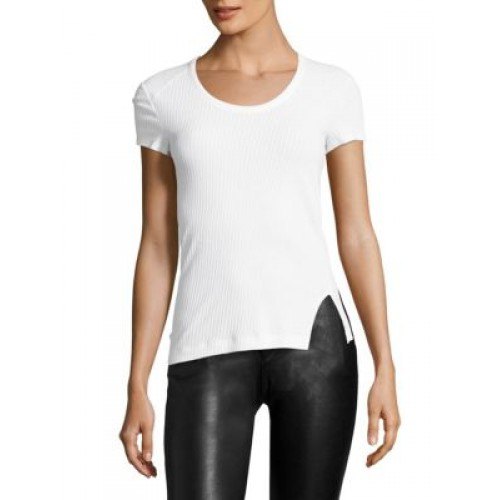 white figure-hugging t-shirt with black leather gaiters
