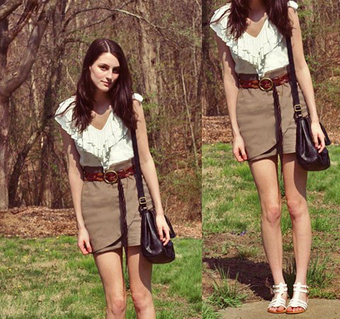 white shirt with fringes and ruffles with a gray wrap skirt with a high waist