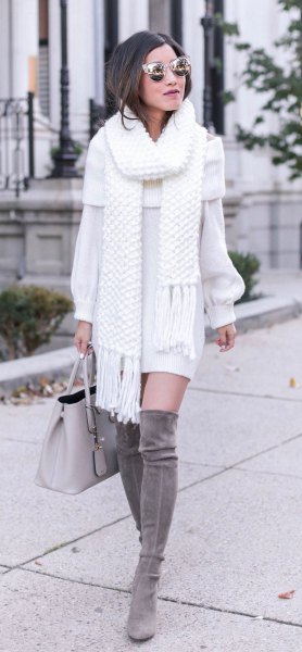 white fringed scarf with matching sweater dress and gray overknee boots