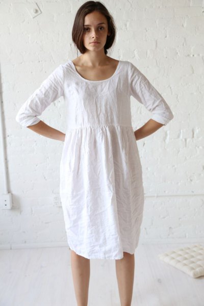 white tunic dress from a ruched linen waist with sneakers