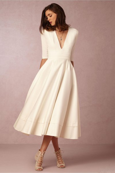 white midi dress with deep V-neckline and deep V-neckline