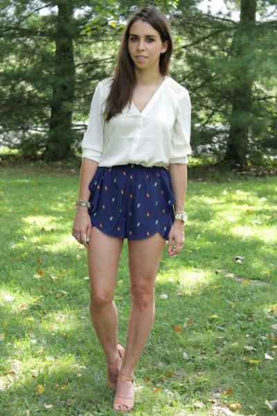 white shirt with half sleeves and dark blue, flowing silk shorts