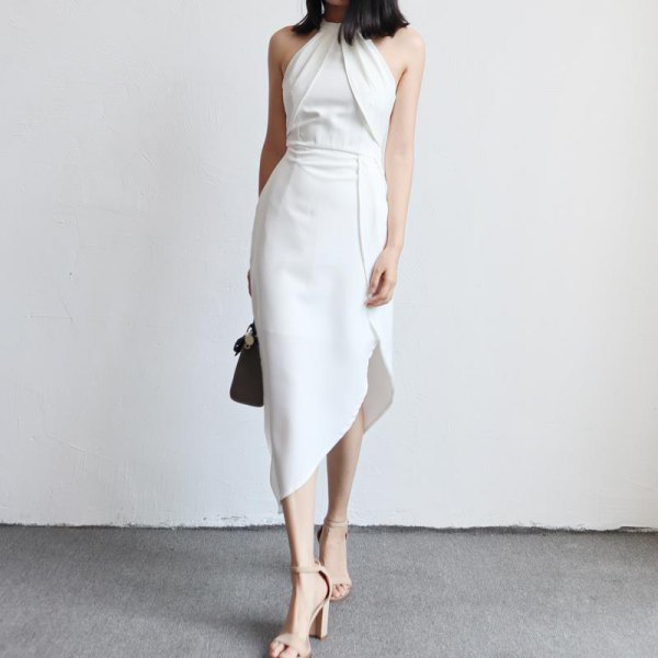white halterneck dress with a gathered waist and asymmetrical tulip dress