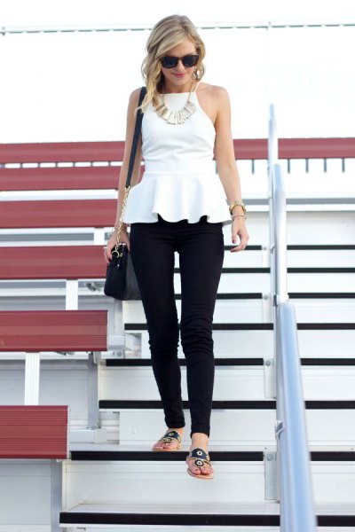 white halterneck peplum blouse with black drainpipe trousers