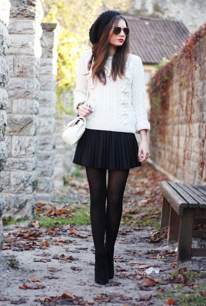 white knitted sweater black mini skirt